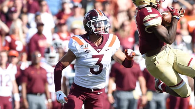 Boston College Eagles wide receiver Kobay White (9) catches a pass while Virginia Tech Hokies defensive back Caleb Farley (3) defends during the first half at Alumni Stadium.